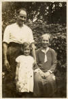 Informal family group photographed in a garden