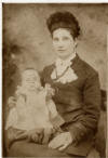 Formal portrait - a baby in the arms of a young woman